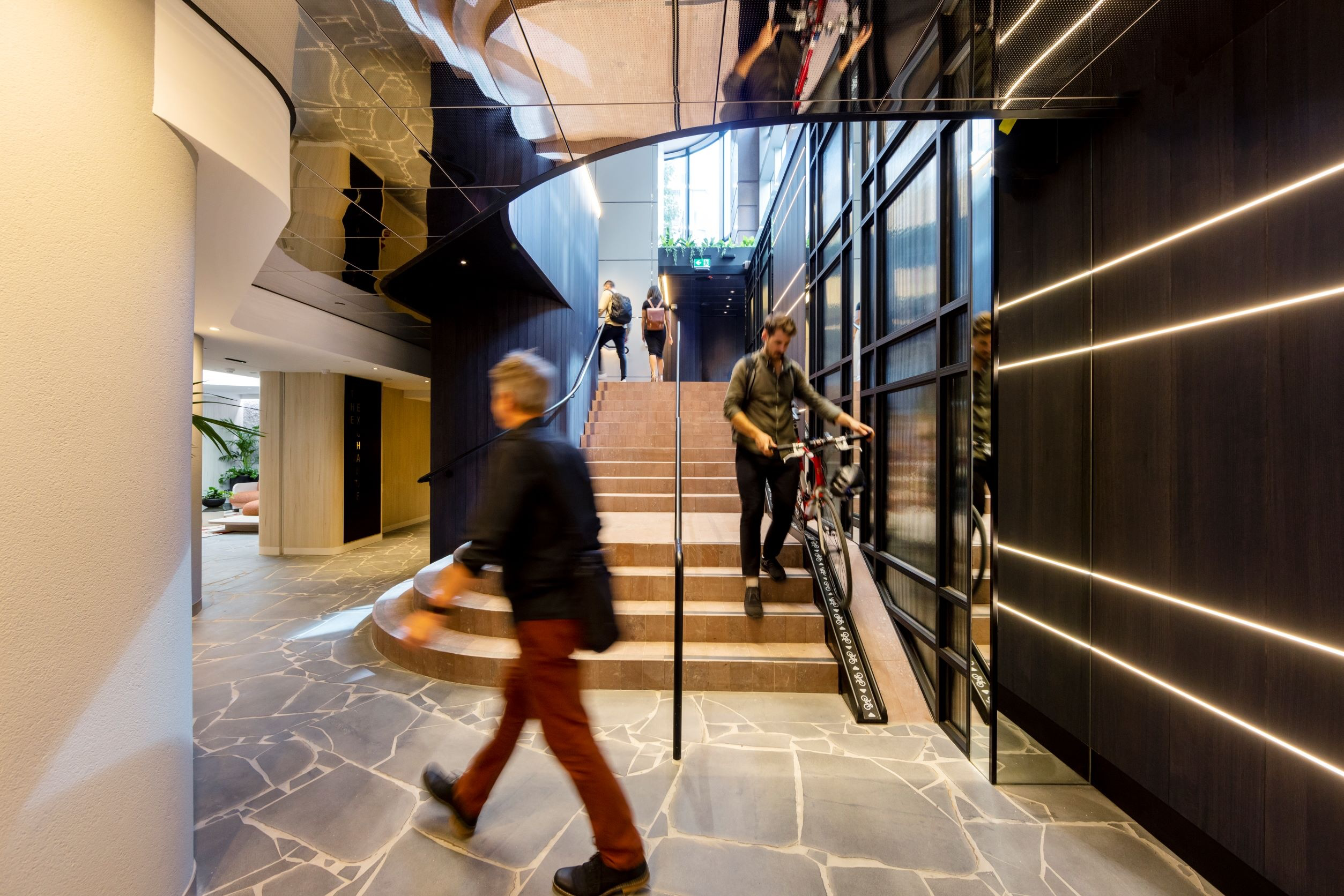Stairs (designed correctly with wheel channel) accompanied by a EOT lift OR a narrow ramp (under 1.5m wide)