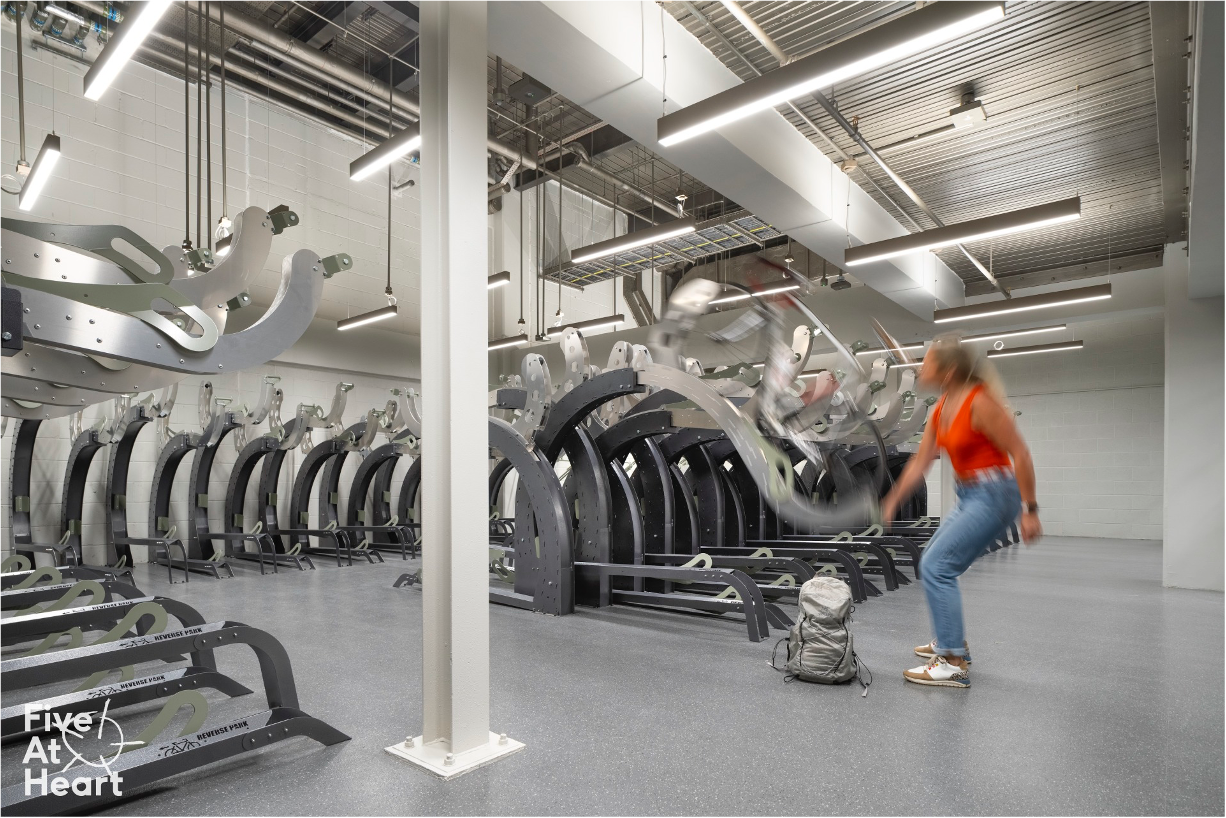 Is the top rack counter balanced and smooth to use? Can you can easily push the bike with minimal strength and lifting  all in one motion?