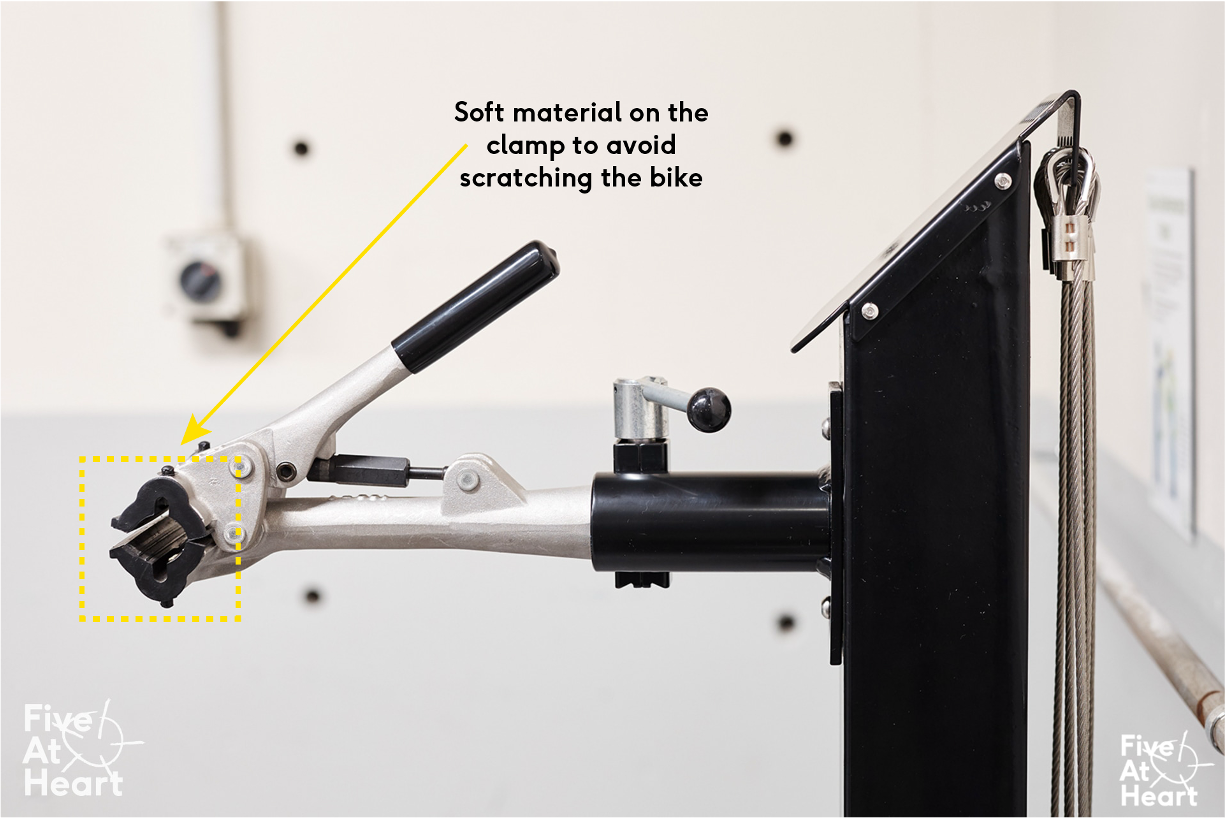 Does the clamp feature a softer material to prevent scratching the bike during use?