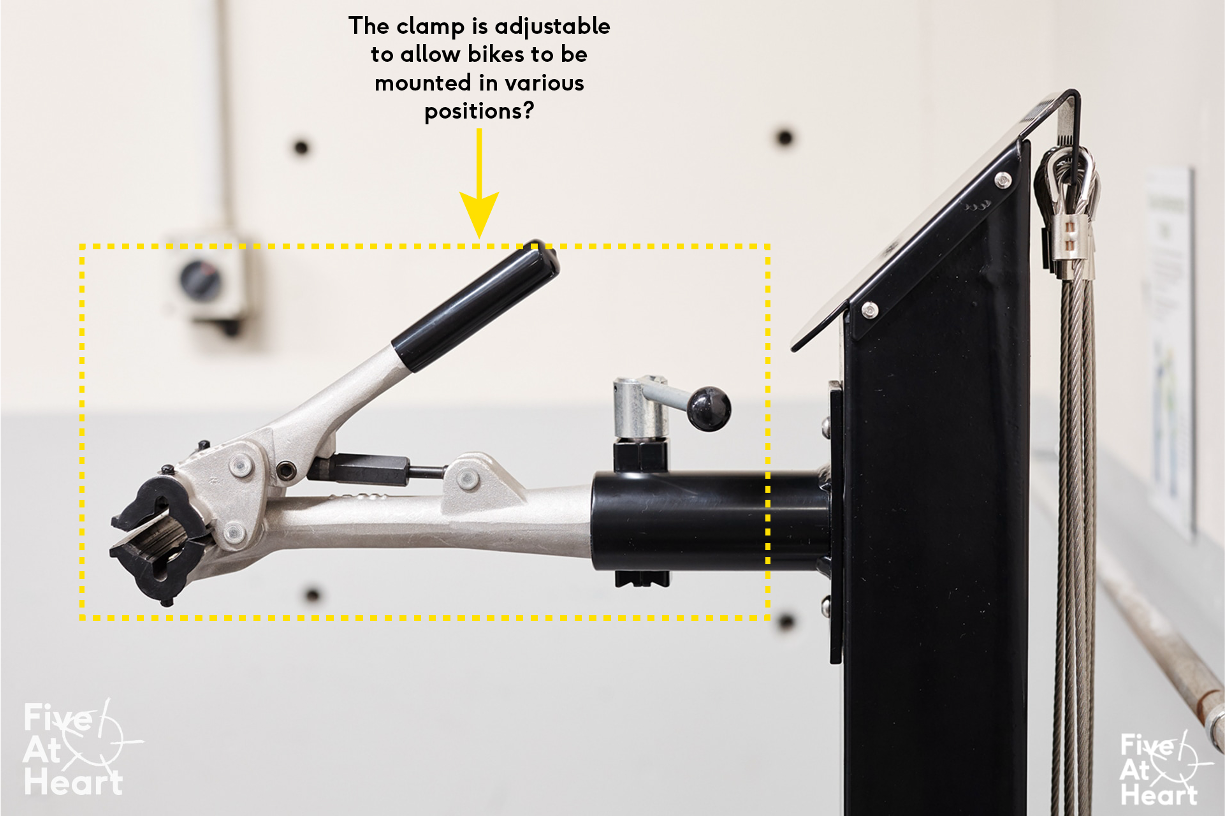 Is there a commercial-grade clamp which is adjustable when it comes to tension and position? Which securely holds the bike in various positions without damage.